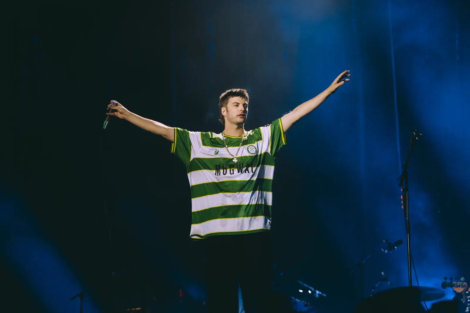Grian Chatten of Fontaines D.C. headlining Reading Festival, 28 August 2026, wearing the Cwmbran Celtic Mogwai shirt