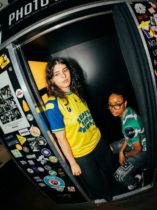 Two models in the Le Pub photo booth